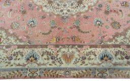 Corner detail of 2000s Tabriz 50/60/70 Raj rug showing border pattern and Cork pile