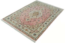 Corner detail of 2000s Tabriz 50/60/70 Raj rug showing border pattern and Cork pile