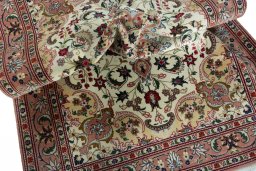 Surface texture of 2000s Tabriz 50/60/70 Raj rug with natural Cork and intricate pattern