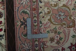 Backside of handmade 2000s Tabriz 50/60/70 Raj rug showing knot structure and weave density