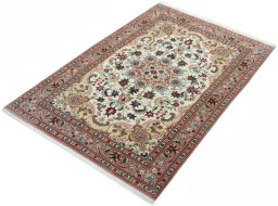 Corner detail of 2000s Tabriz 50/60/70 Raj rug showing border pattern and Cork pile