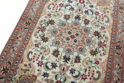 Backside of handmade 2000s Tabriz 50/60/70 Raj rug showing knot structure and weave density