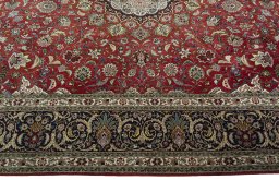 Corner detail of 2000s Tabriz 50/60/70 Raj rug showing border pattern and Cork pile
