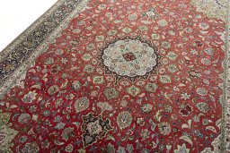 Backside of handmade 2000s Tabriz 50/60/70 Raj rug showing knot structure and weave density