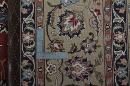 Backside of handmade 2000s Tabriz 50/60/70 Raj rug showing knot structure and weave density