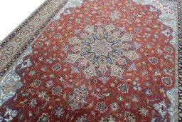 Backside of handmade 2000s Tabriz 50/60/70 Raj rug showing knot structure and weave density
