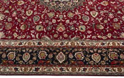 Corner detail of 2000s Tabriz 50/60/70 Raj rug showing border pattern and Cork pile