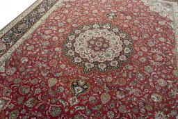 Backside of handmade 2000s Tabriz 50/60/70 Raj rug showing knot structure and weave density