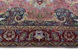 Corner detail of 2000s Tabriz 50/60/70 Raj rug showing border pattern and Cork pile