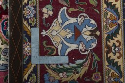 Backside of handmade 2000s Tabriz 50/60/70 Raj rug showing knot structure and weave density