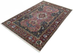 Corner detail of 2000s Tabriz 50/60/70 Raj rug showing border pattern and Cork pile