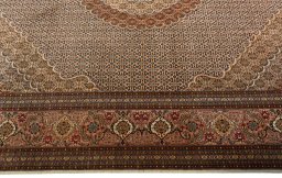 Corner detail of 2000s Tabriz 50/60/70 Raj rug showing border pattern and Cork pile