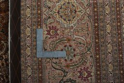 Backside of handmade 2000s Tabriz 50/60/70 Raj rug showing knot structure and weave density