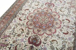 Backside of handmade 2000s Tabriz 50/60/70 Raj rug showing knot structure and weave density