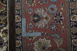 Backside of handmade 2000s Tabriz 50/60/70 Raj rug showing knot structure and weave density