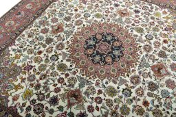 Backside of handmade 2000s Tabriz 50/60/70 Raj rug showing knot structure and weave density