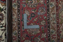Backside of handmade 2000s Tabriz 50/60/70 Raj rug showing knot structure and weave density