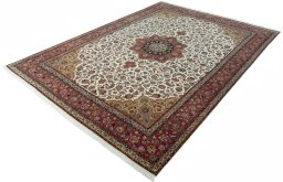 Corner detail of 2000s Tabriz 50/60/70 Raj rug showing border pattern and Cork pile