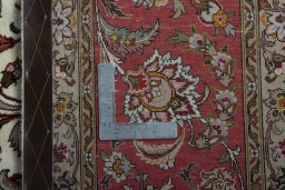 Backside of handmade 2000s Tabriz 50/60/70 Raj rug showing knot structure and weave density