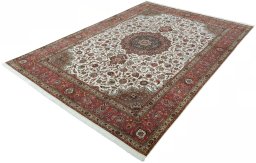 Corner detail of 2000s Tabriz 50/60/70 Raj rug showing border pattern and Cork pile