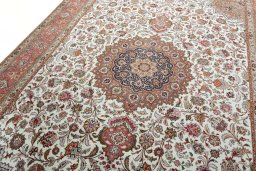 Backside of handmade 2000s Tabriz 50/60/70 Raj rug showing knot structure and weave density
