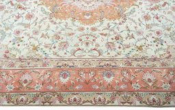 Corner detail of 2000s Tabriz 50/60/70 Raj rug showing border pattern and Cork pile