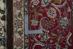 Backside of handmade 2000s Tabriz 50/60/70 Raj rug showing knot structure and weave density