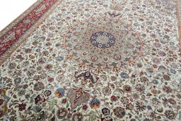 Backside of handmade 2000s Tabriz 50/60/70 Raj rug showing knot structure and weave density