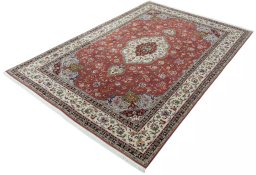 Corner detail of 2000s Tabriz 50/60/70 Raj rug showing border pattern and Cork pile