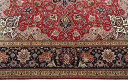 Corner detail of 2000s Tabriz 50/60/70 Raj rug showing border pattern and Cork pile