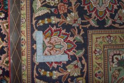 Backside of handmade 2000s Tabriz 50/60/70 Raj rug showing knot structure and weave density