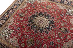 Backside of handmade 2000s Tabriz 50/60/70 Raj rug showing knot structure and weave density
