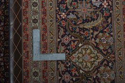 Backside of handmade 1970s Tabriz 50/60/70 Raj rug showing knot structure and weave density