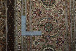 Backside of handmade 2000s Tabriz 50/60/70 Raj rug showing knot structure and weave density