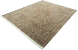 Corner detail of 2000s Tabriz 50/60/70 Raj rug showing border pattern and Cork pile