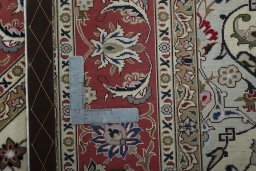 Backside of handmade New Tabriz 50/60/70 Raj rug showing knot structure and weave density