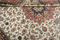 Close-up detail of 2000s Tabriz 50/60/70 Raj rug from Iran / Persia showing Cork weave