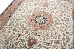 Backside of handmade 2000s Tabriz 50/60/70 Raj rug showing knot structure and weave density