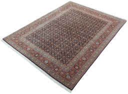 Corner detail of New Tabriz 50/60/70 Raj rug showing border pattern and Cork pile