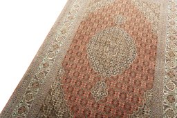 Backside of handmade New Tabriz 50/60/70 Raj rug showing knot structure and weave density