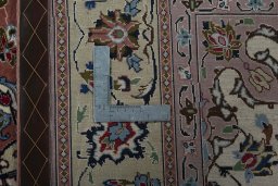 Backside of handmade New Tabriz 50/60/70 Raj rug showing knot structure and weave density