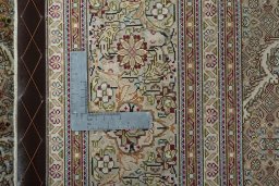 Backside of handmade New Tabriz 50/60/70 Raj rug showing knot structure and weave density
