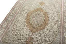 Backside of handmade New Tabriz 50/60/70 Raj rug showing knot structure and weave density