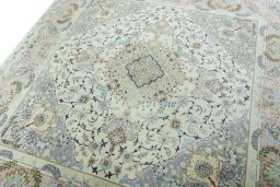 Backside of handmade New Tabriz 50/60/70 Raj rug showing knot structure and weave density