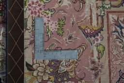 Backside of handmade New Tabriz 50/60/70 Raj rug showing knot structure and weave density
