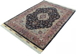 Corner detail of New Tabriz 50/60/70 Raj rug showing border pattern and Cork pile