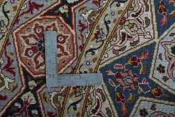 Corner detail of New Tabriz 50/60/70 Raj rug showing border pattern and Cork pile