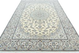 Surface texture of 2000s Nain rug with natural Wool and intricate pattern