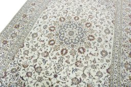 Backside of handmade 2000s Kashan rug showing knot structure and weave density
