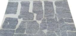 Backside of handmade New Morocco rug showing knot structure and weave density
